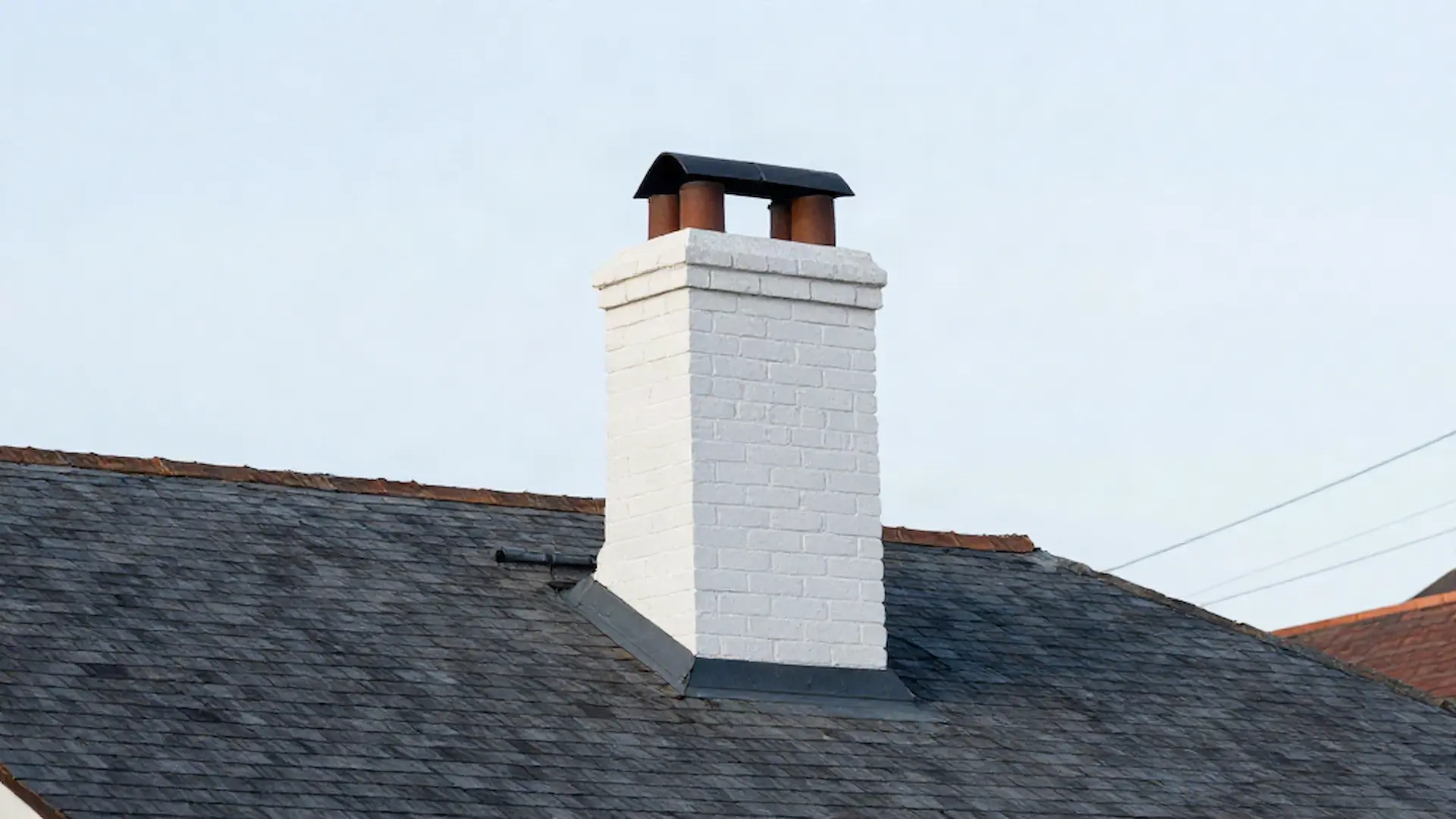Brick chimney on a home served by Maple Island Chimney Cleaning in Philadelphia, PA